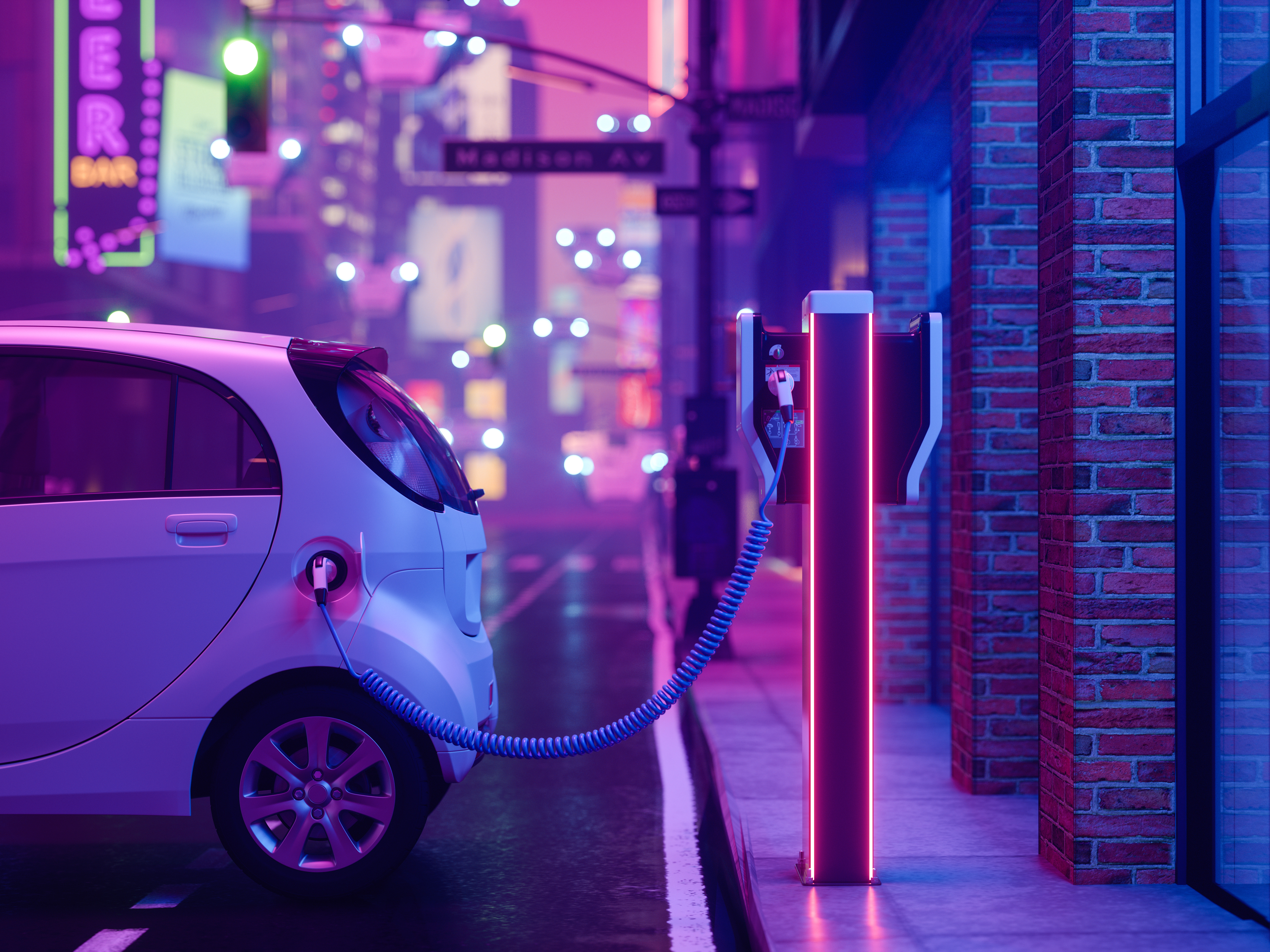 Ein Elektroauto wird an einer Ladestation in einer neonbeleuchteten Stadt bei Nacht aufgeladen.